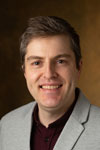 A portrait photo of Andrew Greenwood, PhD