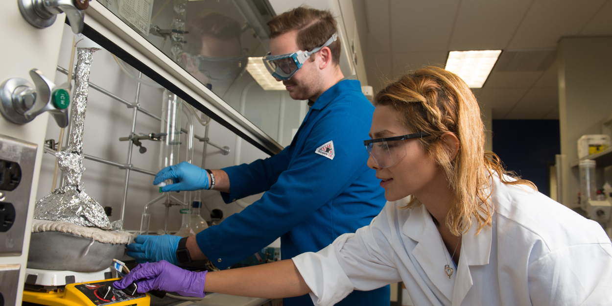 Two students working in a lab at SIUE.