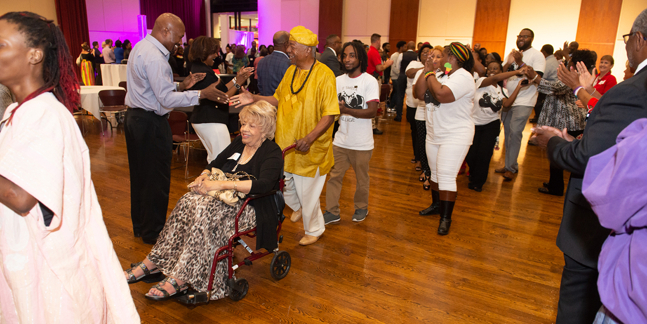 People in the Meridian Ballroom at the Morris University Center.