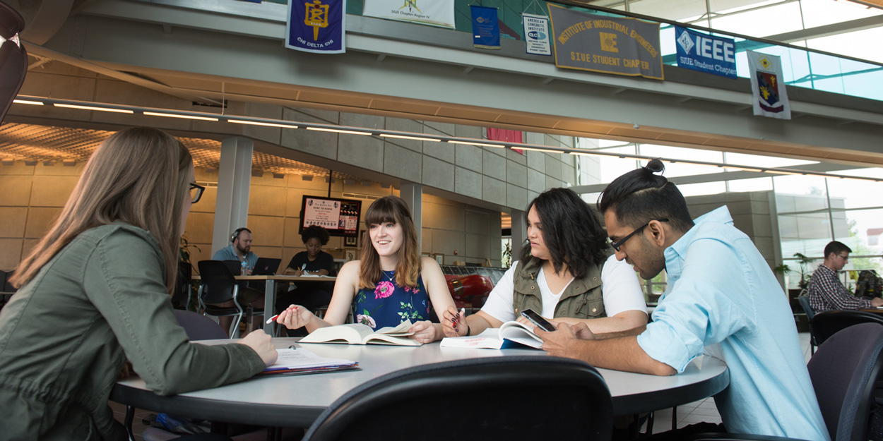 Student working at a table in the Engineering Building at SIUE.