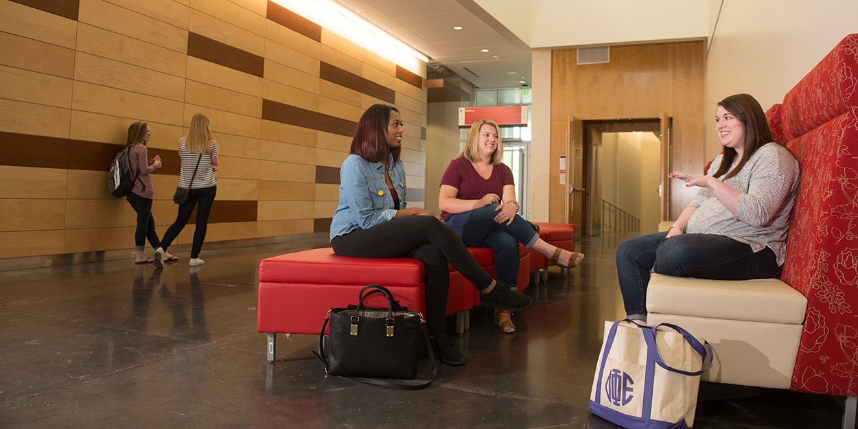 Two SIUE Students reading a paper.