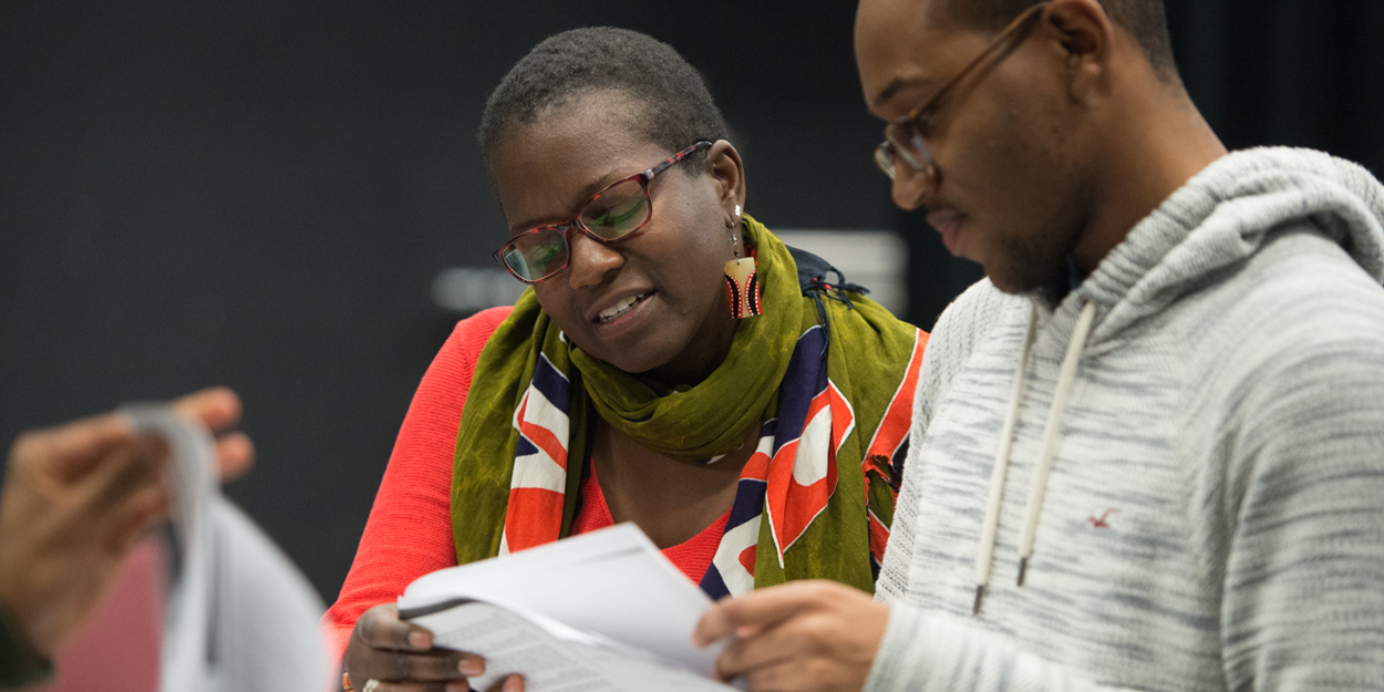 Two SIUE Students reading a paper.