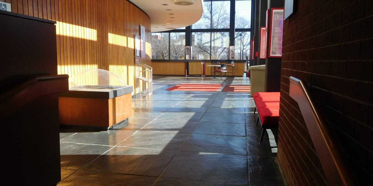 Dunham Hall lobby during the mid-afternoon with the sun shining on the walls. 