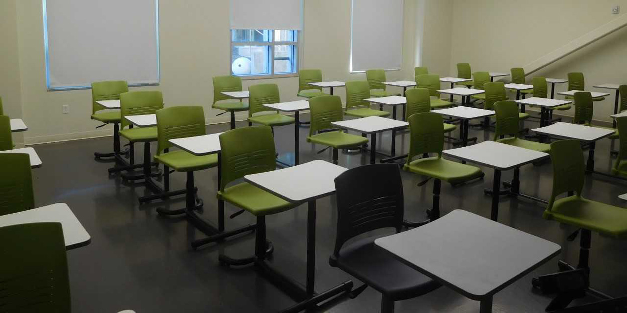 Classroom with green chairs. 