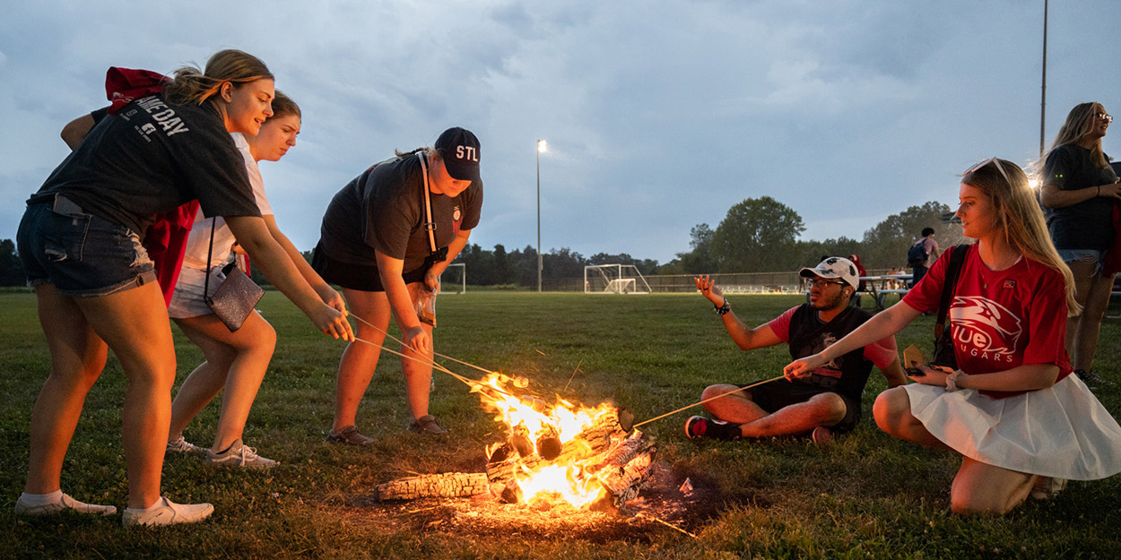 Students enjoying a small fire.