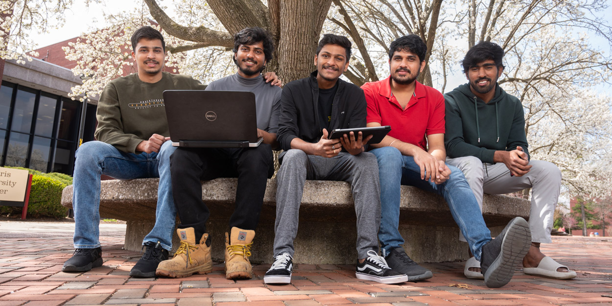 SIUE Students sitting on the quadrangle.