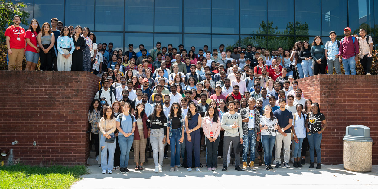 International Students in front of the Cougar Statue.