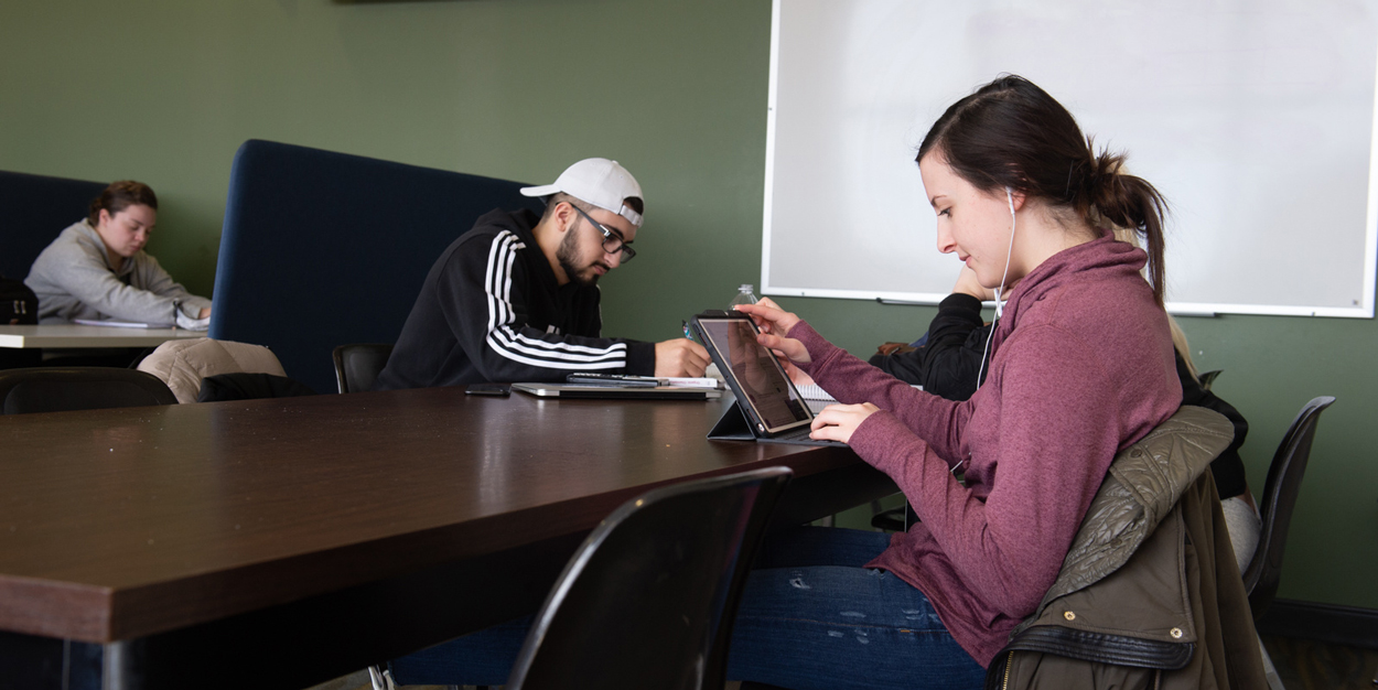 Three students studying at SIUE.