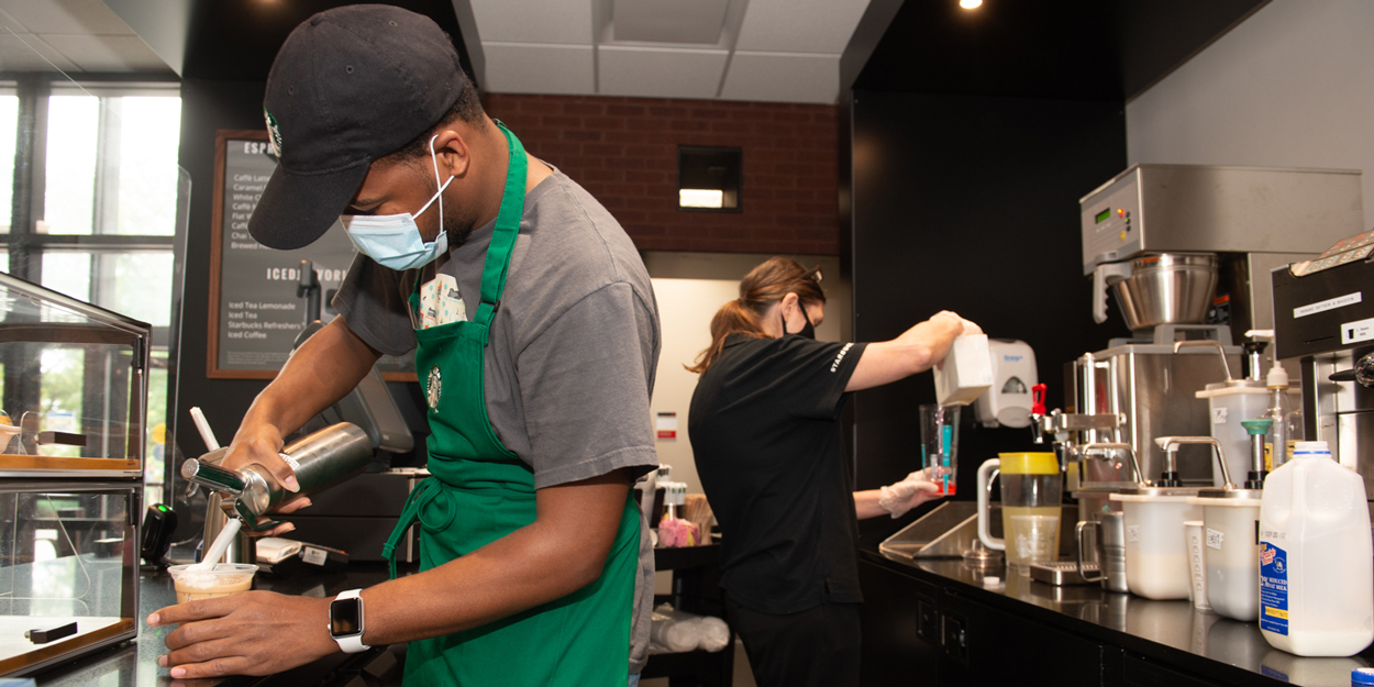 Two workers at the Starbucks in the Lovejoy Library. 