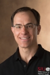 A portrait photo of Erik Kirk, PhD