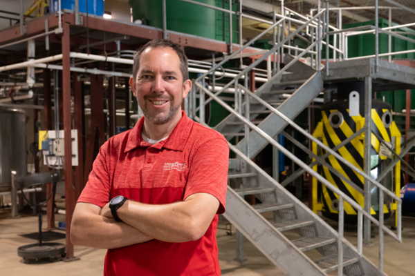 Chris Gordon standing in engineering building