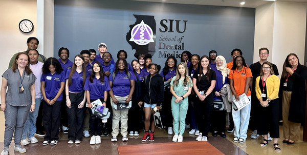 Group of high school students pose for photo