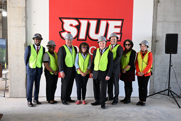 Group photo of Chancellor Minor and politicians in hard hats