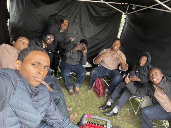 Actors under holding tent