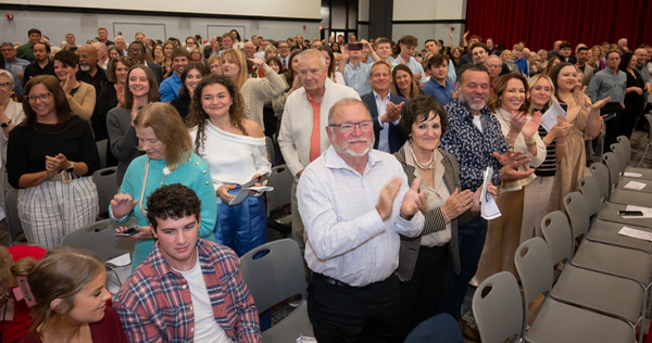 Standing ovation from friends and family attending Class of 2028 SIU SDM white coat ceremony